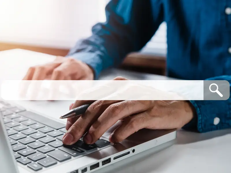 Person researching online search queries and AI-ready content on a laptop on chad ruiz marketing expert in Louisiana blog
